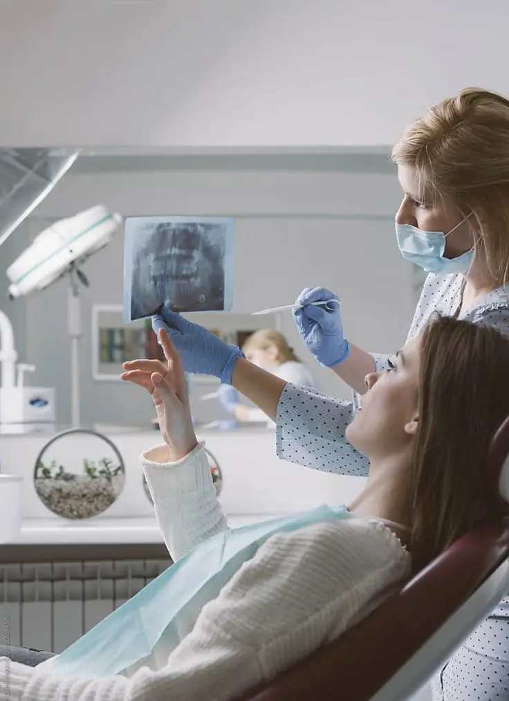 Dental Implant Therapy 24/7 Virtual Dental Consultation Growing smiles dental clinic | Dentist examining a patient's teeth