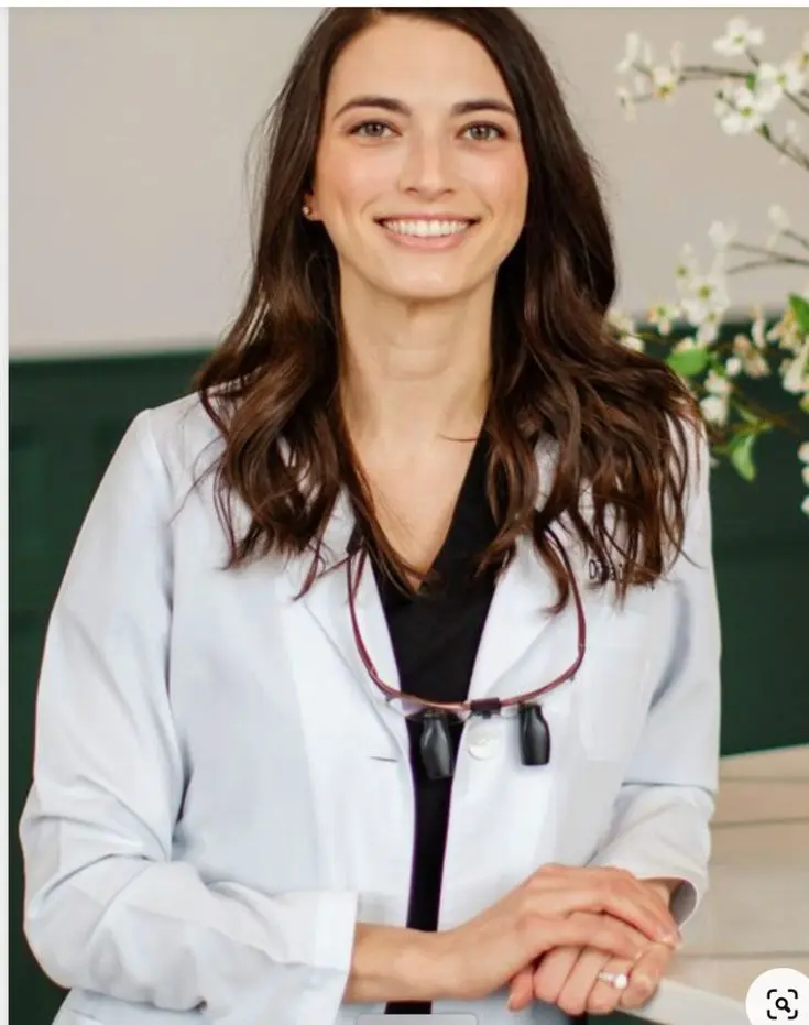 Growing smiles dental clinic | Female dentist standing in a dental office