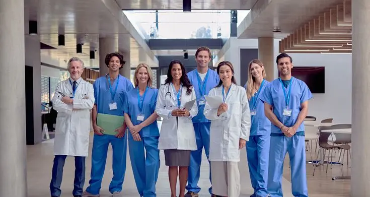: About Our Dental Clinic Professional dental team standing together